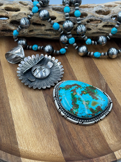 Sonoran Gold Sunface Pendant by F. Charley, Navajo