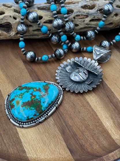 Sonoran Gold Sunface Pendant by F. Charley, Navajo