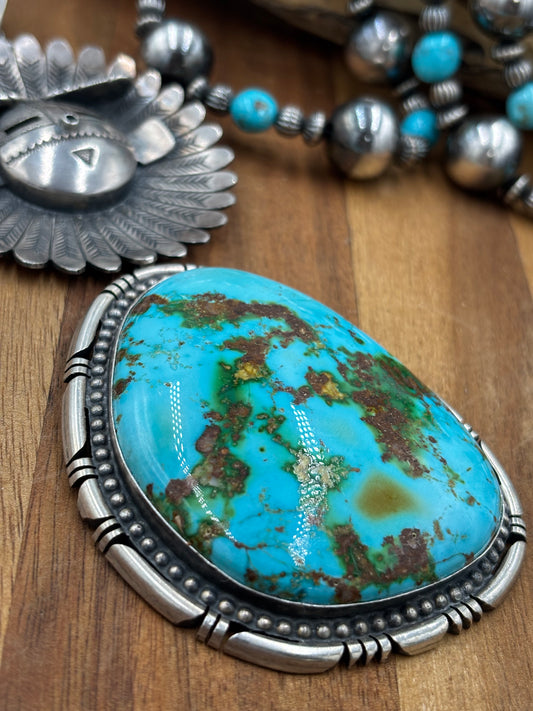 Sonoran Gold Sunface Pendant by F. Charley, Navajo