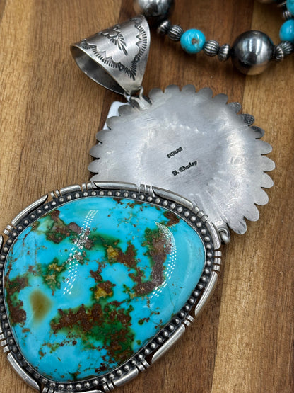 Sonoran Gold Sunface Pendant by F. Charley, Navajo