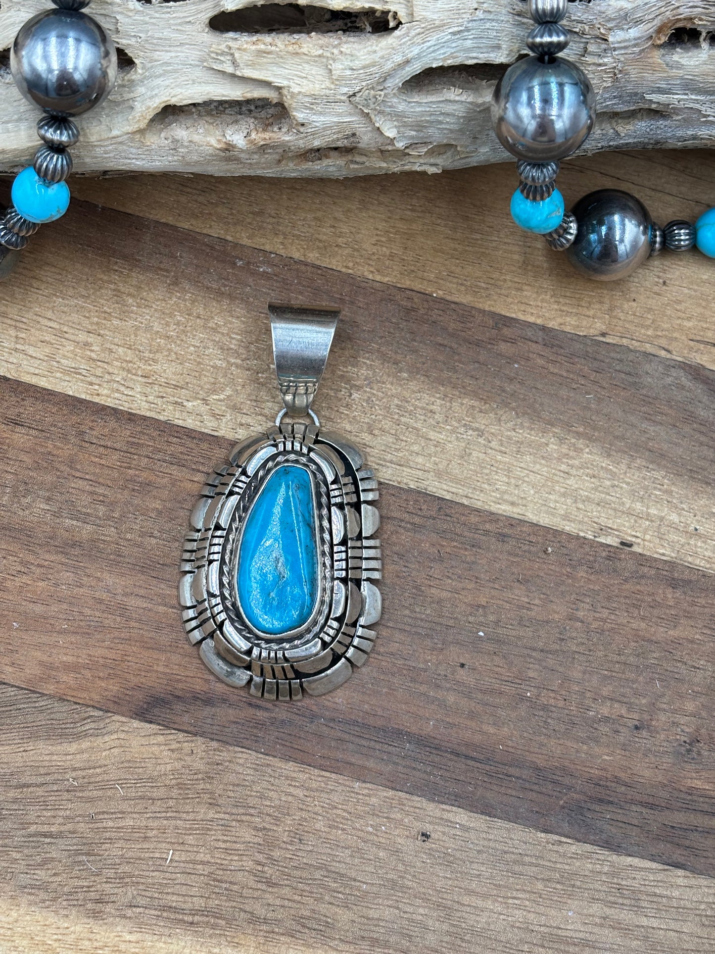 Kingman Turquoise Pendant by Reggie Hoskie, Navajo