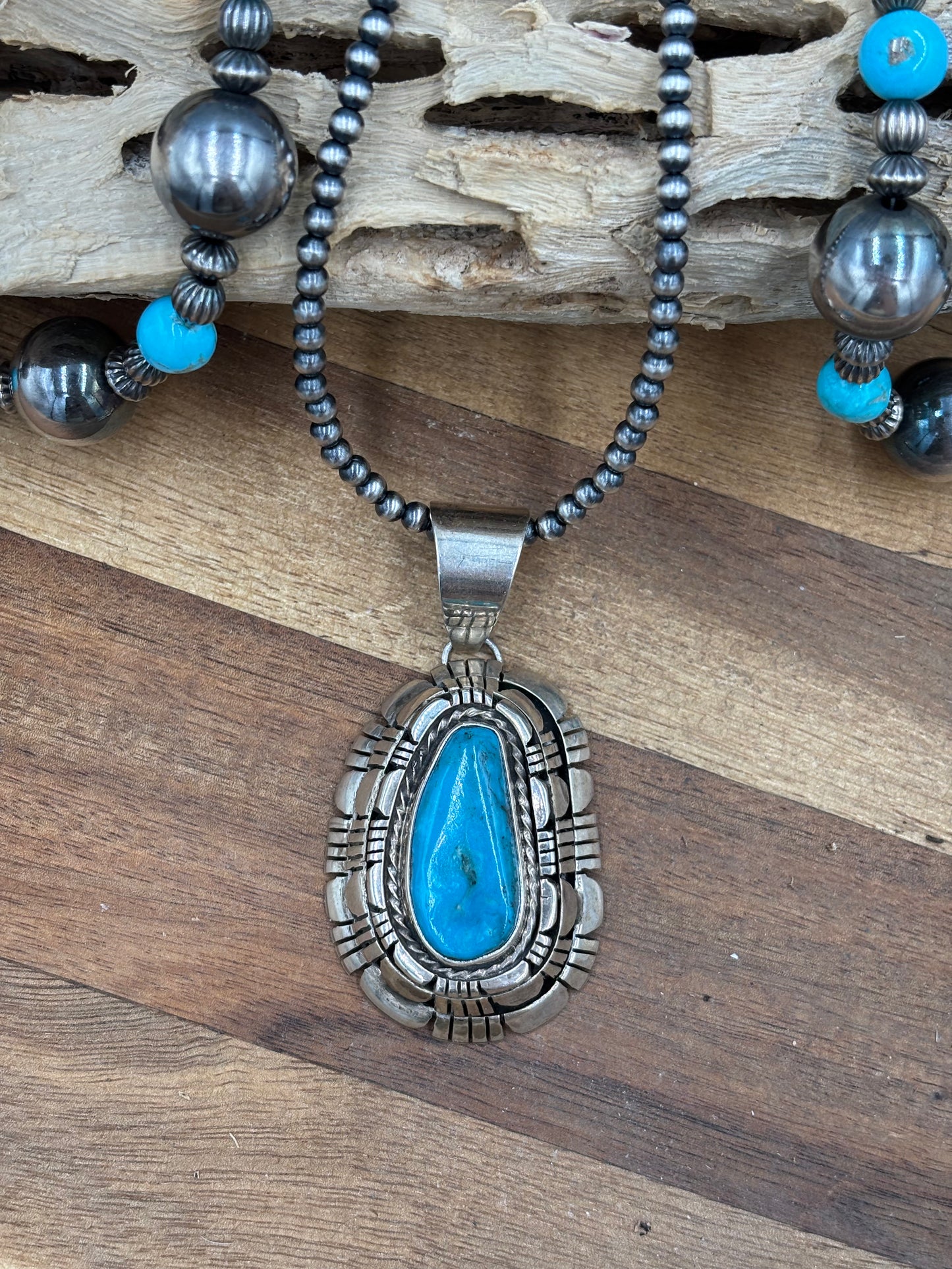 Kingman Turquoise Pendant by Reggie Hoskie, Navajo