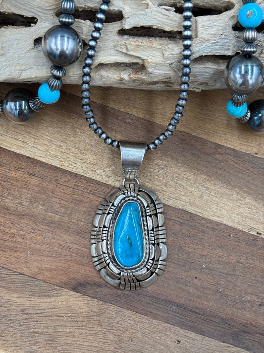 Kingman Turquoise Pendant by Reggie Hoskie, Navajo
